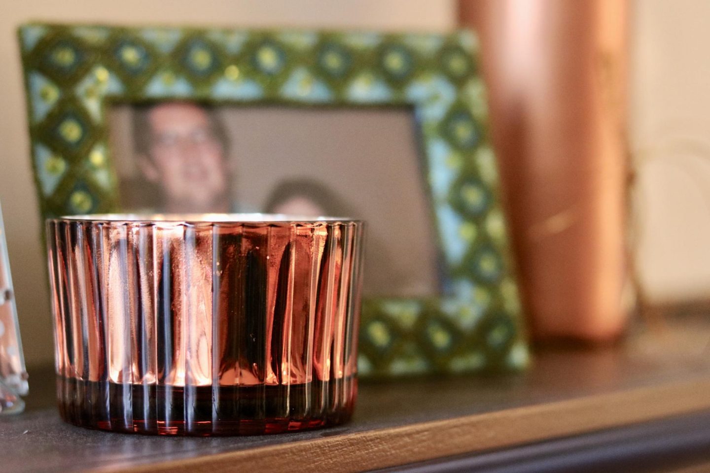 Orange candle on a shelf