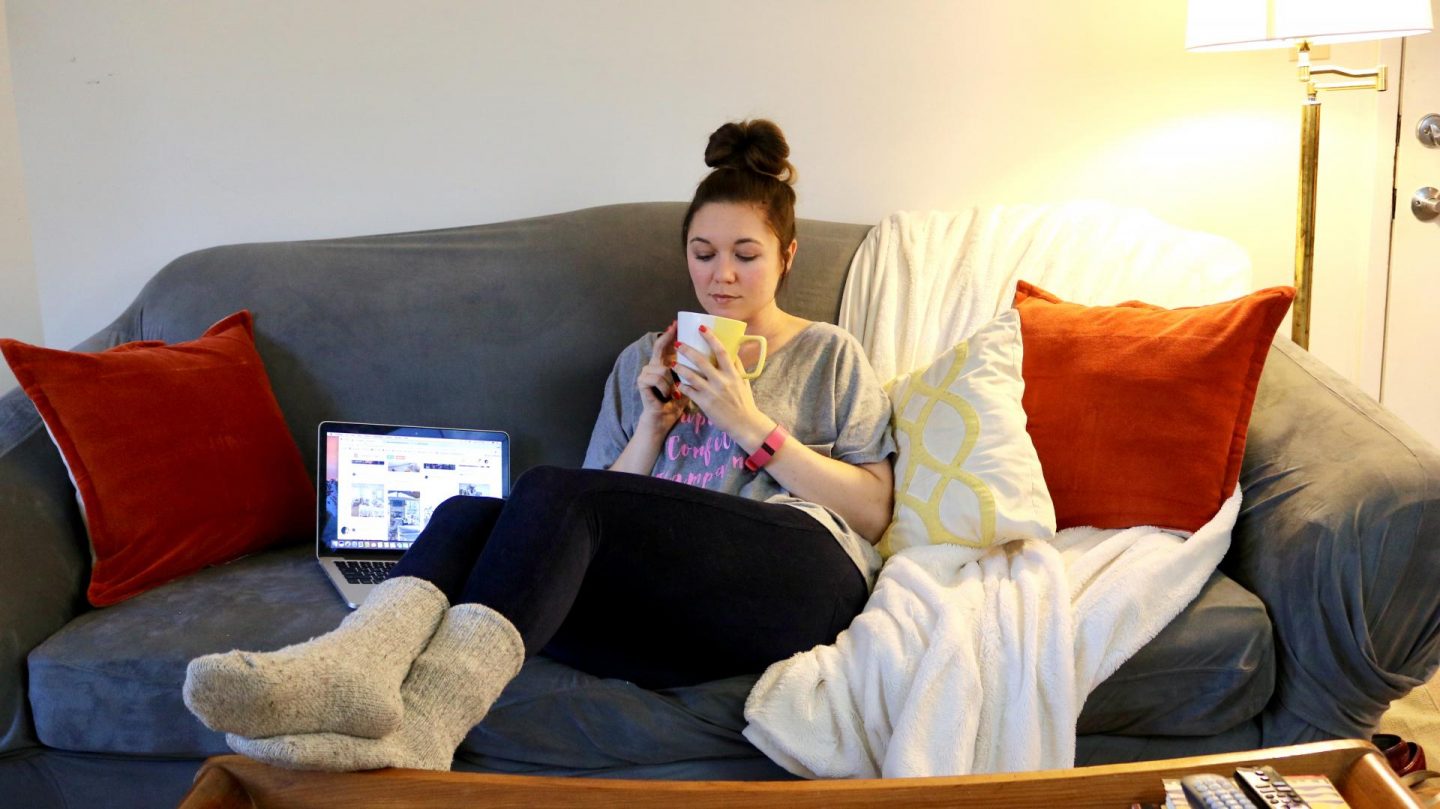 Katie on couch with coffee