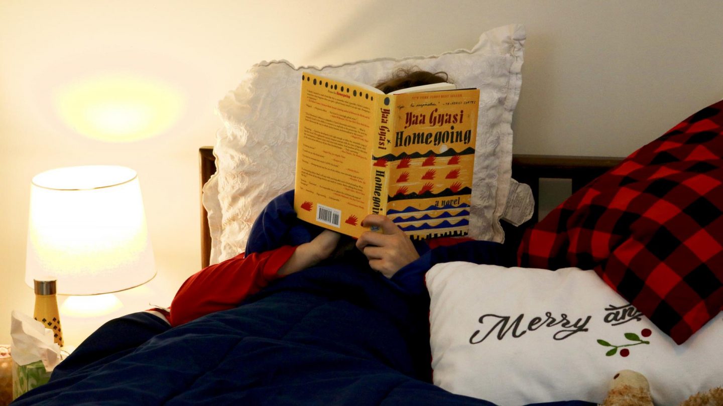 Katie in bed with a book