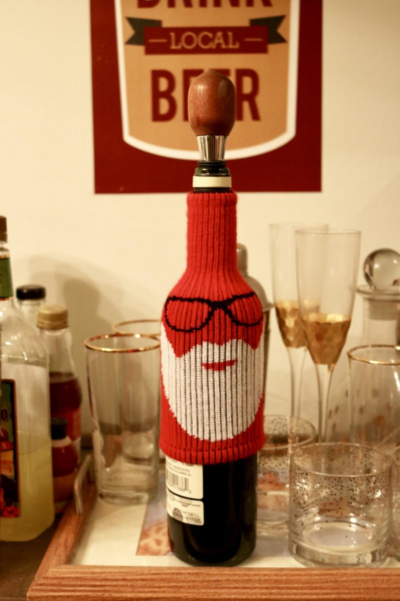 wine wearing Santa cover