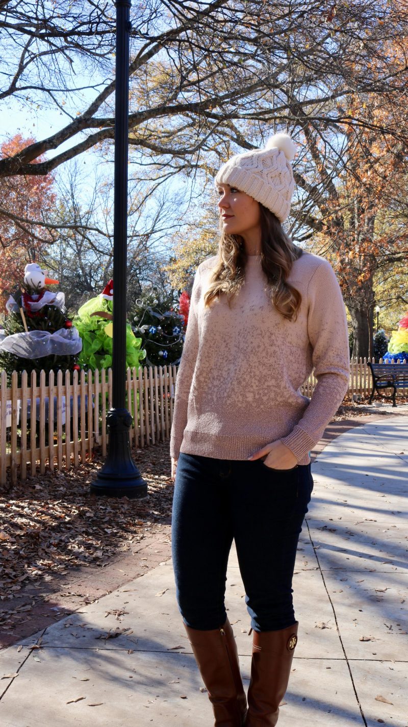 Katie in pink sweater looking left