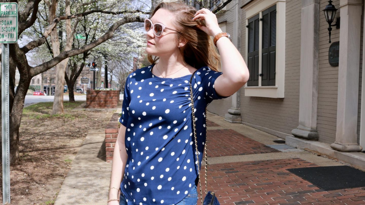 Katie in a navy polka dot shirt