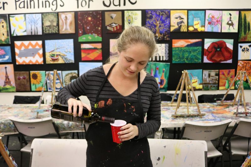 girl pouring wine